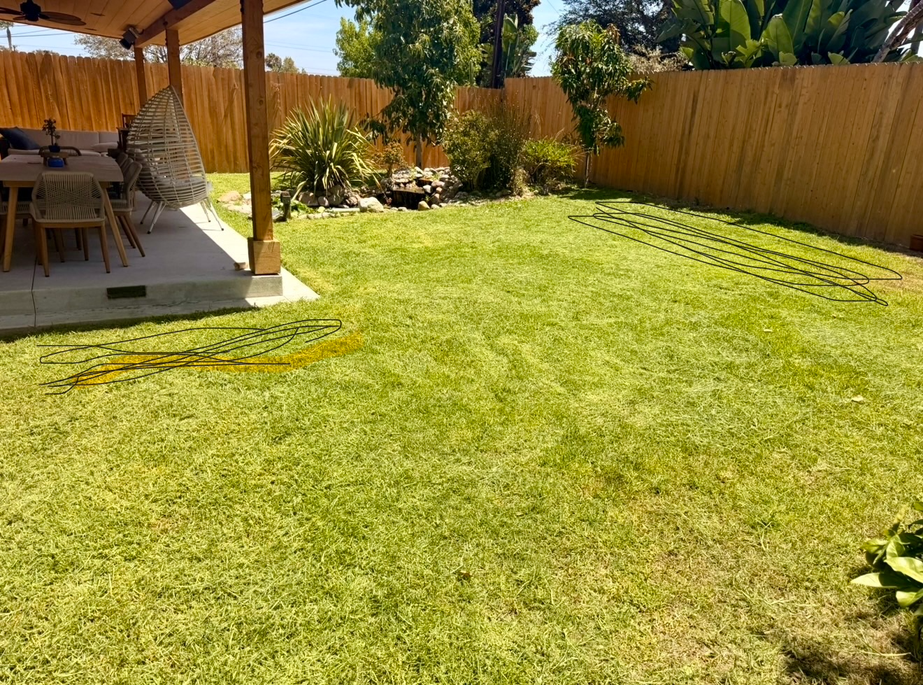 Covered patio looking out over a fresh cut lawn